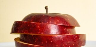 an apple sliced in half on a table