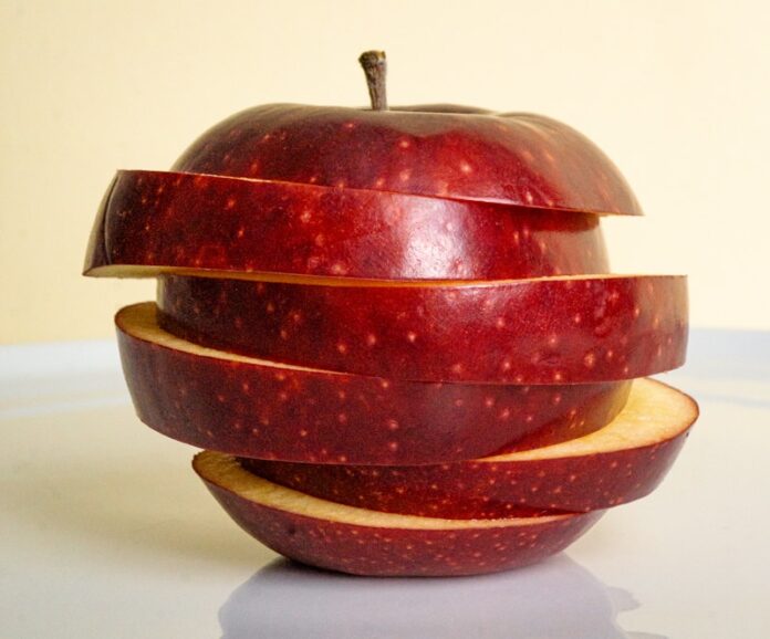 an apple sliced in half on a table
